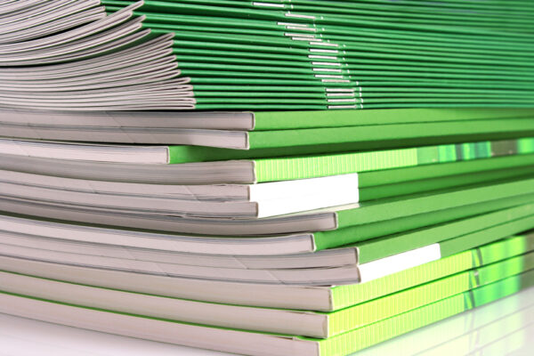 pile of green magazines or booklets